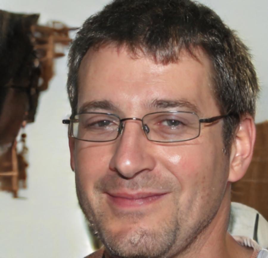 Professional headshot of experienced finance educator and remote learning specialist